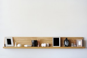 Stylish bookshelf on a white wall